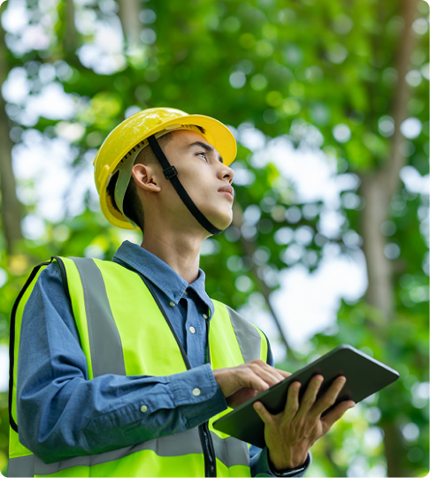 Sustainability work in the UAE with worker inspecting environment