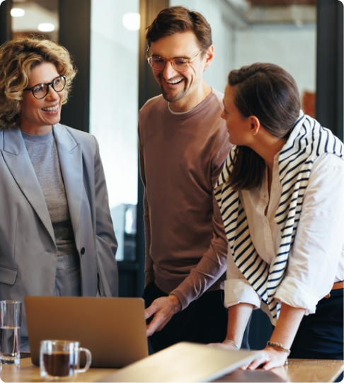 Professionals discussing work together in an office setting