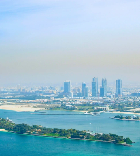 Aerial view of Dubai skyline with islands representing our industry sectors