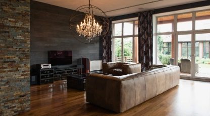 Villa interior design Dubai featuring a modern luxury living room with bespoke wood flooring and elegant lighting