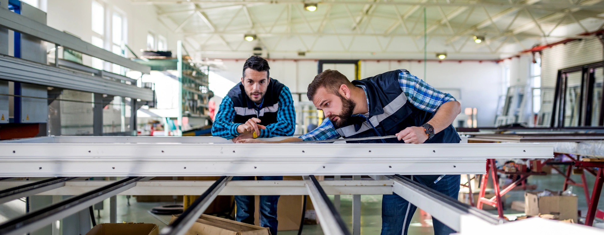 Professionals fabricating Aluminium and Glass Solutions for modern building projects